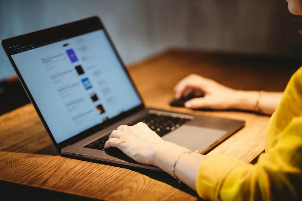 a woman with a laptop on the table